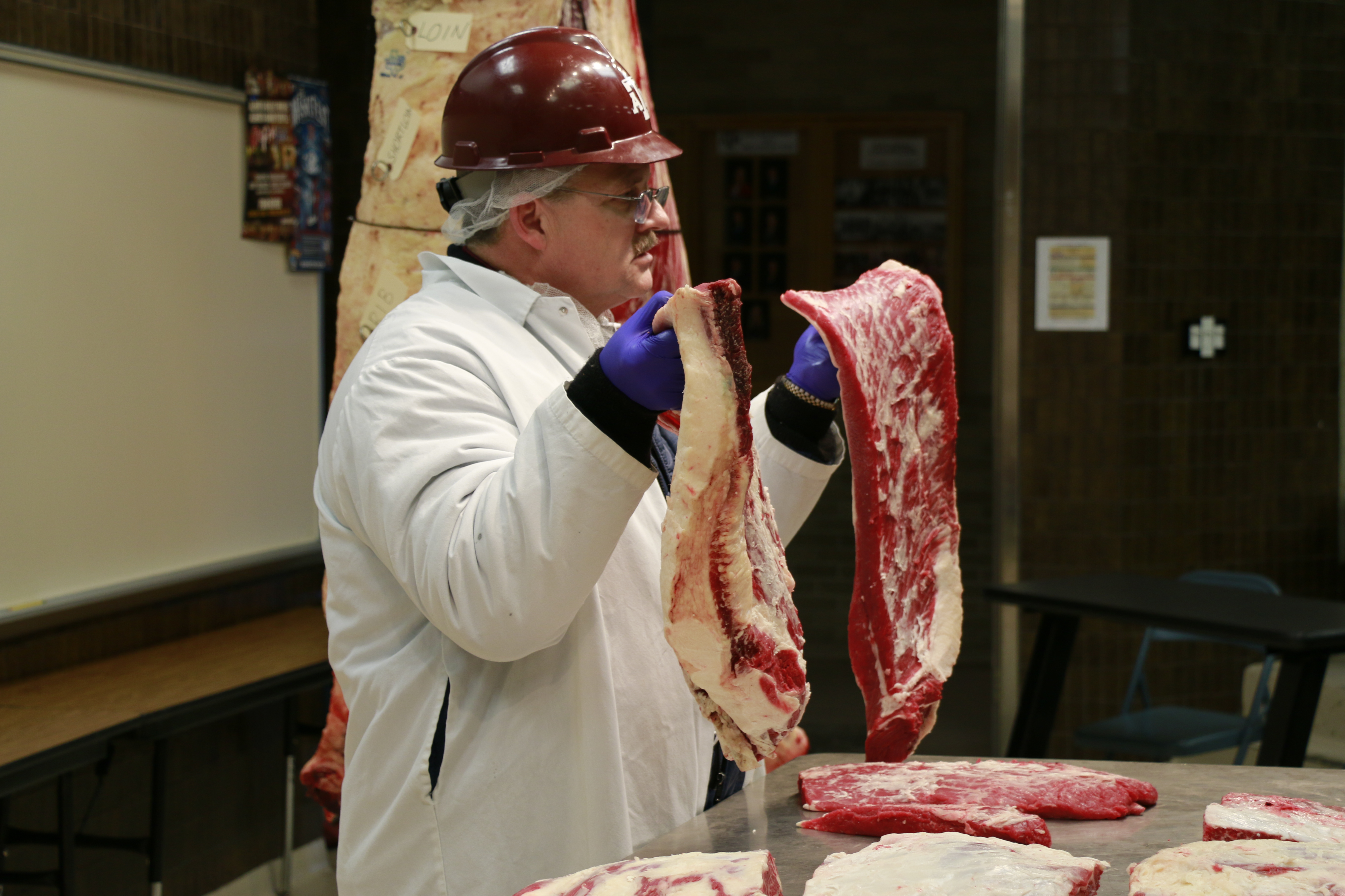 Davey Griffin demonstrating different cutting styles for briskets