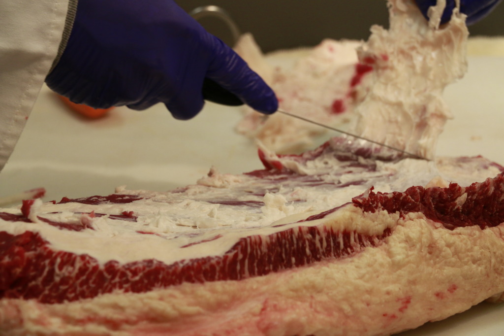 Removing the deckle from a brisket
