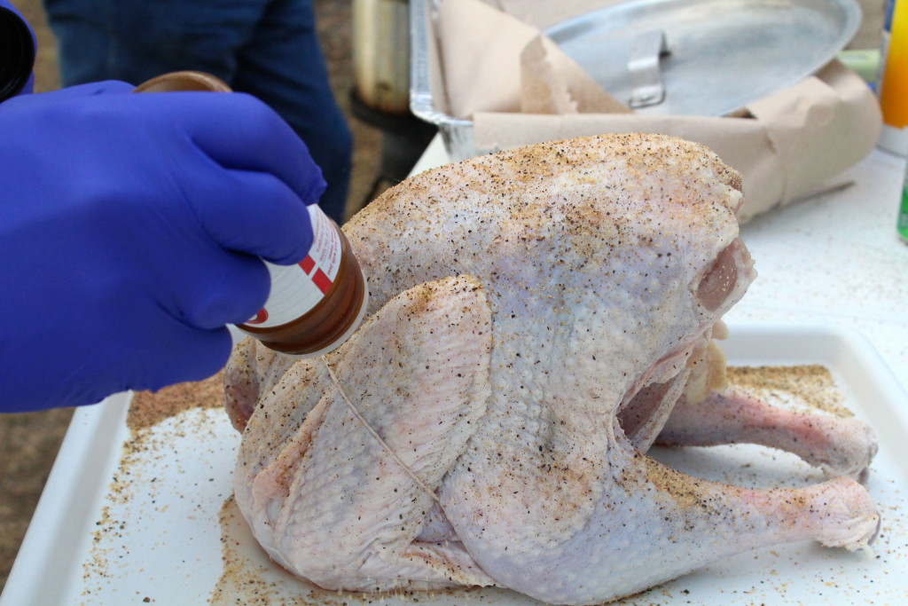 Seasoning turkey (photo by Kathleen Meredith)