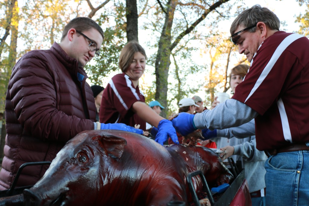 Taylor, Jennifer, and Ray pulling pork