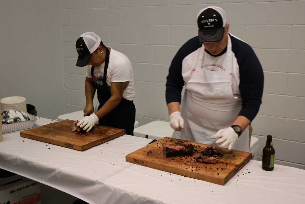 Ronnie Killen (right) slicing and serving beef short ribs