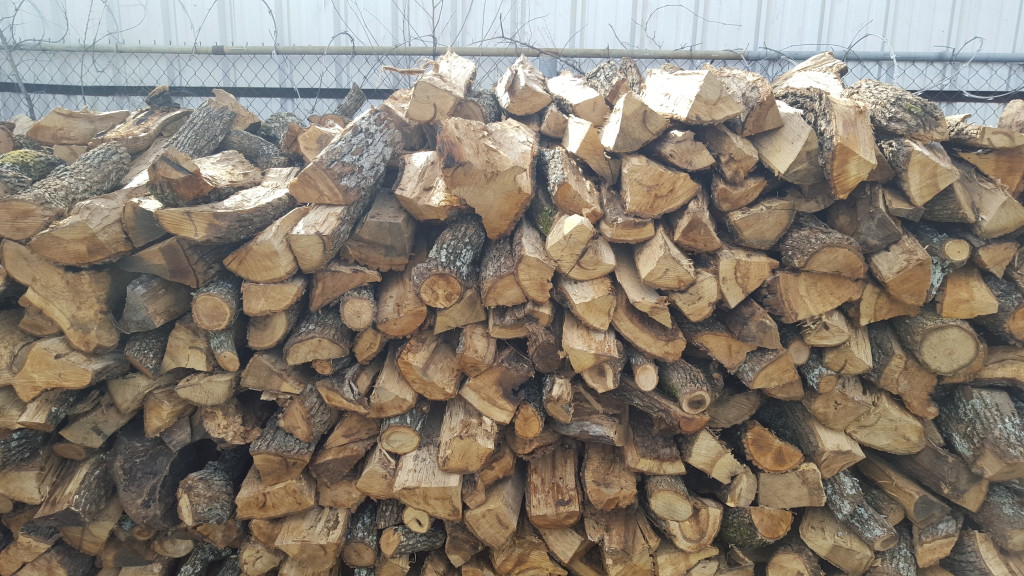 Split oak, partially seasoned, moisture content from 14% to 25%; seasoned wood