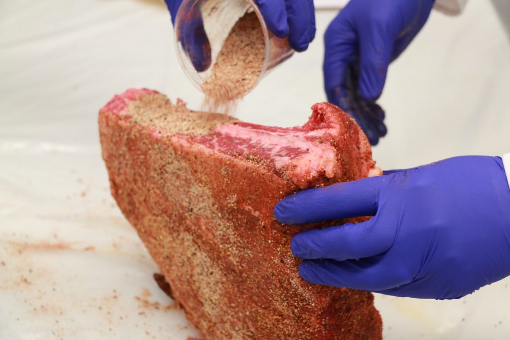 Applying seasonings to beef ribs