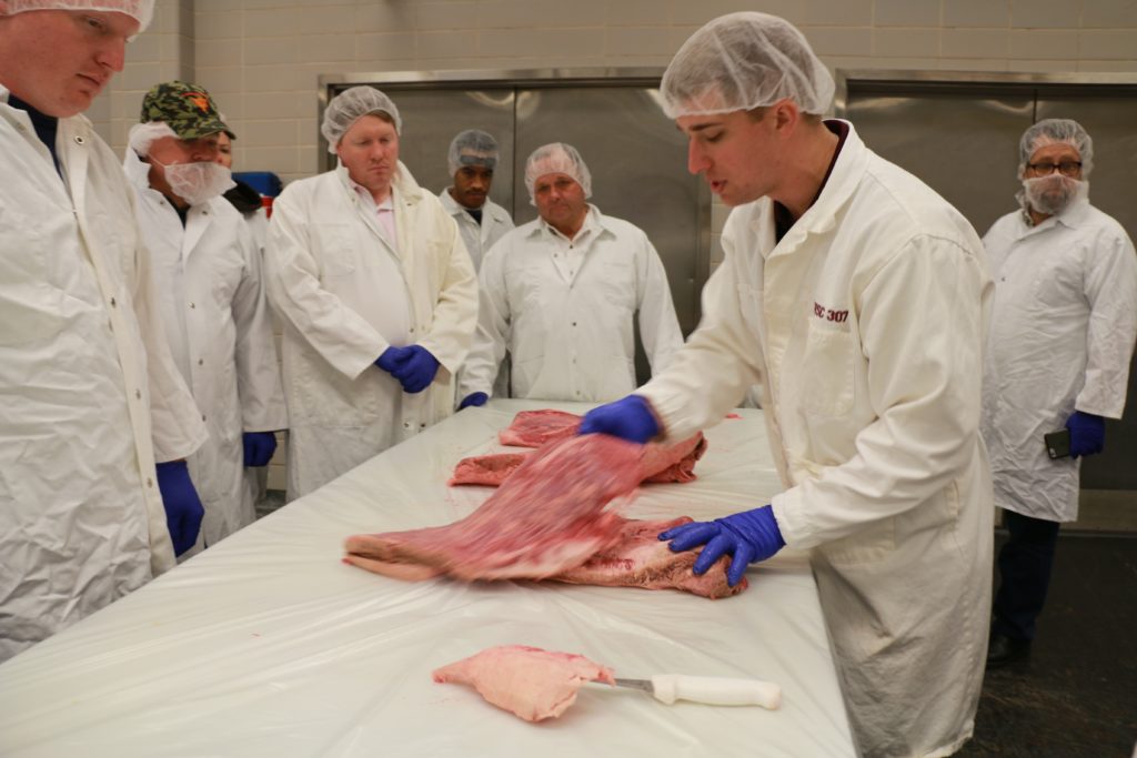 Mark Frenzel showing the anatomy of beef briskets