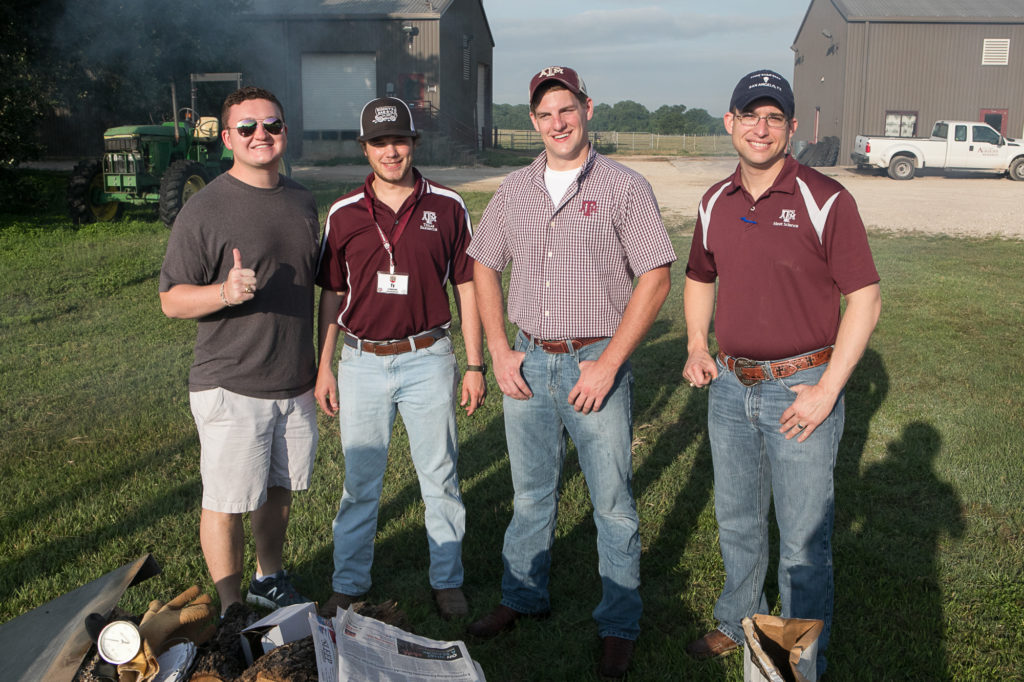 Pig cooking crew: Taylor Rowland, Ty Robertson, Adam Murray, and Mark Frenzel.