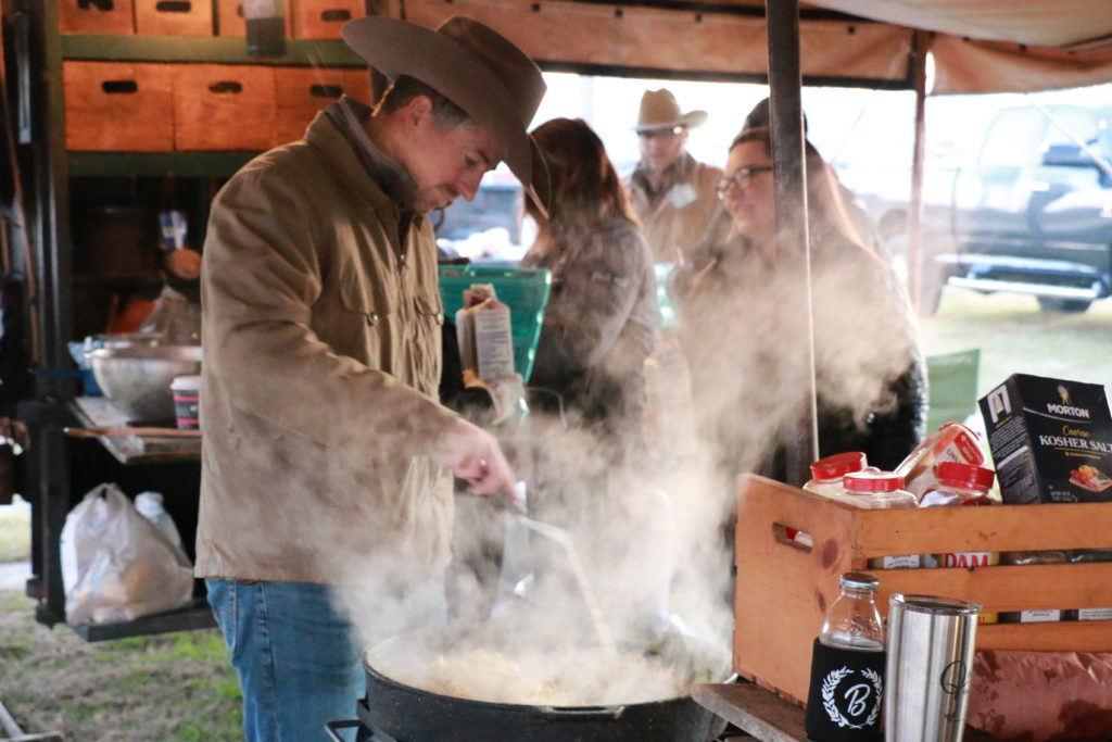 Joe Riscky helping with chuck wagon breakfast for Camp Brisket