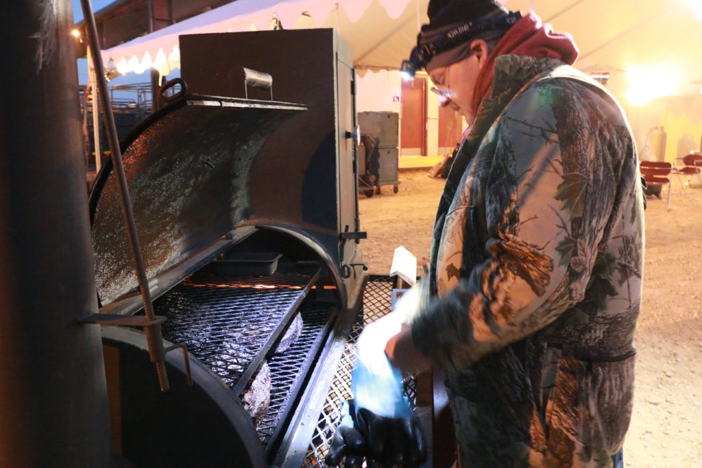Davey Griffin checking briskets during the overnight smoke