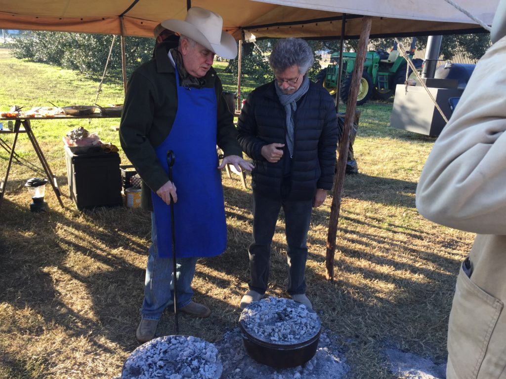 Homer Robertson and Steven Raichlen discussing Dutch oven cooking