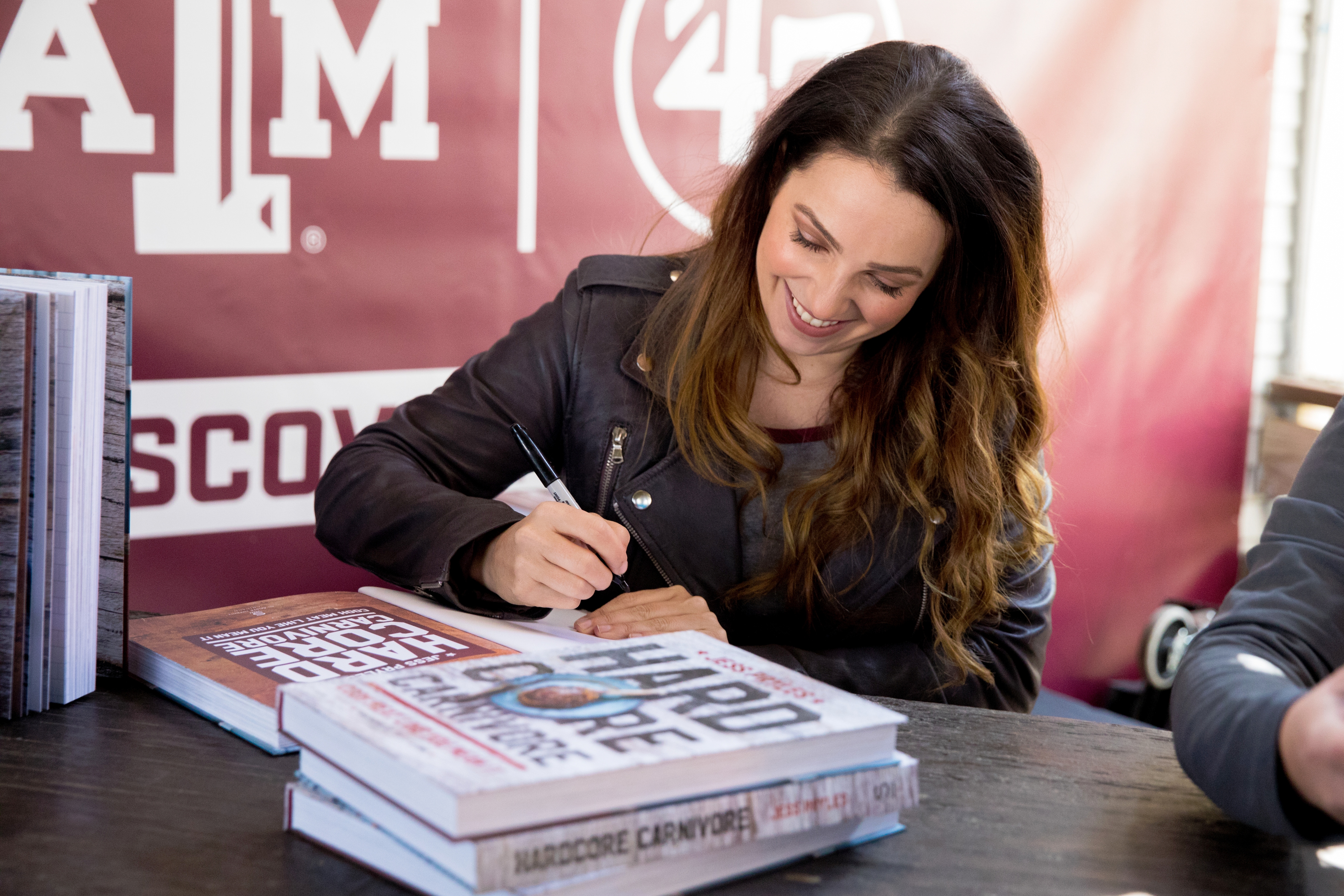 Jess Pryles signing her book, "Hardcore Carnivore" at Texas A&M University event at SXSW