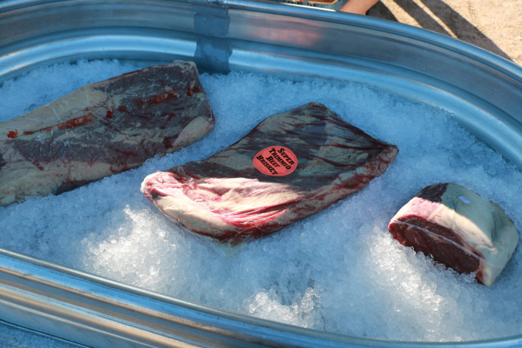 Beef briskets and beef ribeye roast on display