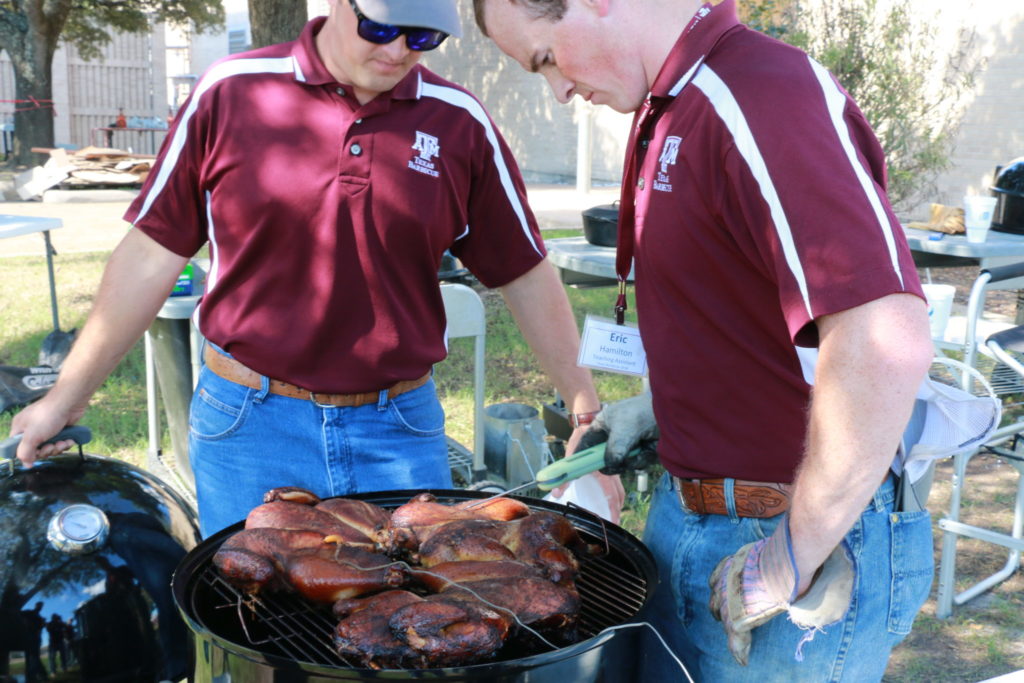 Alec and Eric checking the temperatures on the butterflied chicken