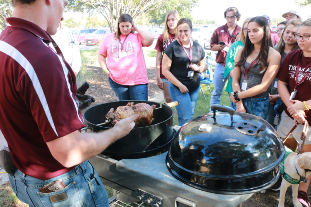 Eric demonstrating the rotisserie chicken