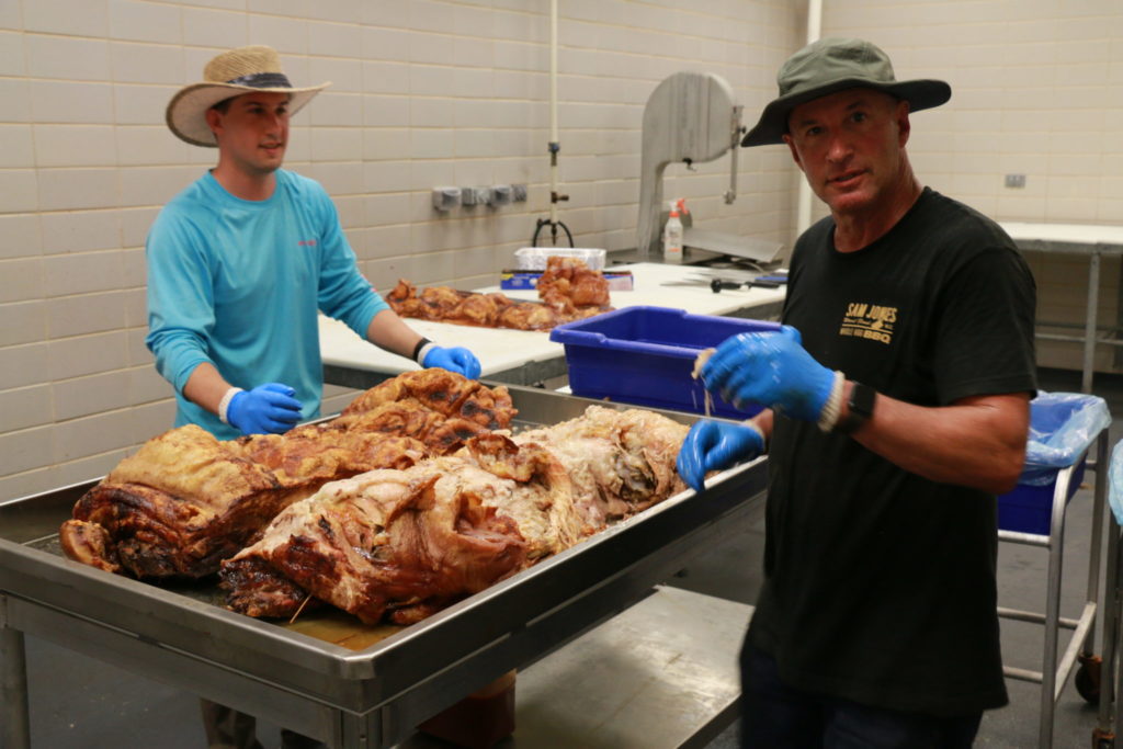 Riley and Todd David, Cattleack Barbeque, pulling/preparing the pork