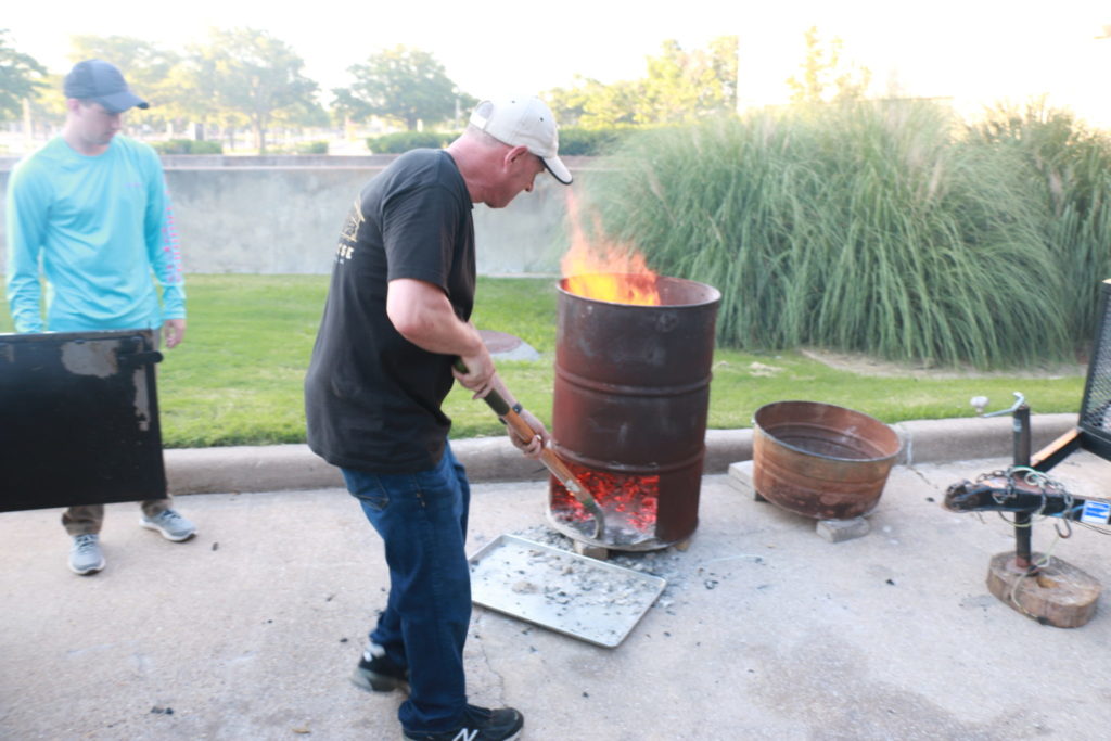 Todd David and burn barrel used to generate coals