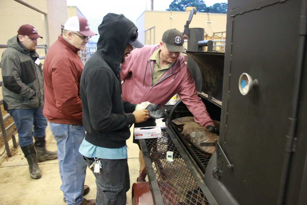 John Brotherton checking brisket temperatures