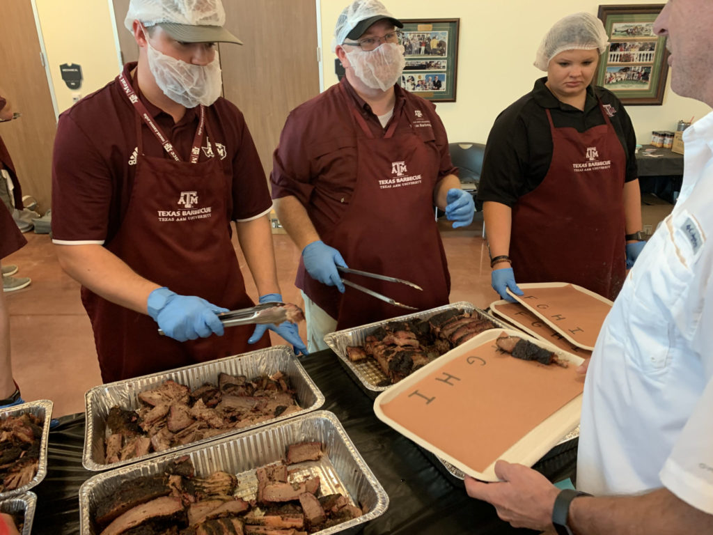 Serving briskets cooked with different woods